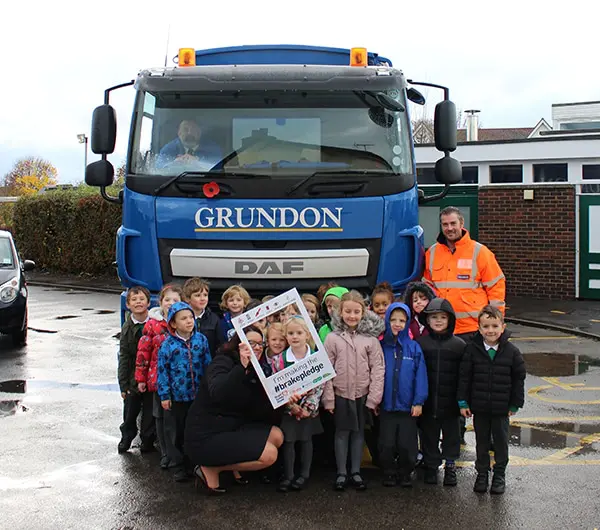 Pupils from St Nicholas’s Primary School in Wallingford and members of the Grundon team make the BRAKE pledge in support of Road Safety Week