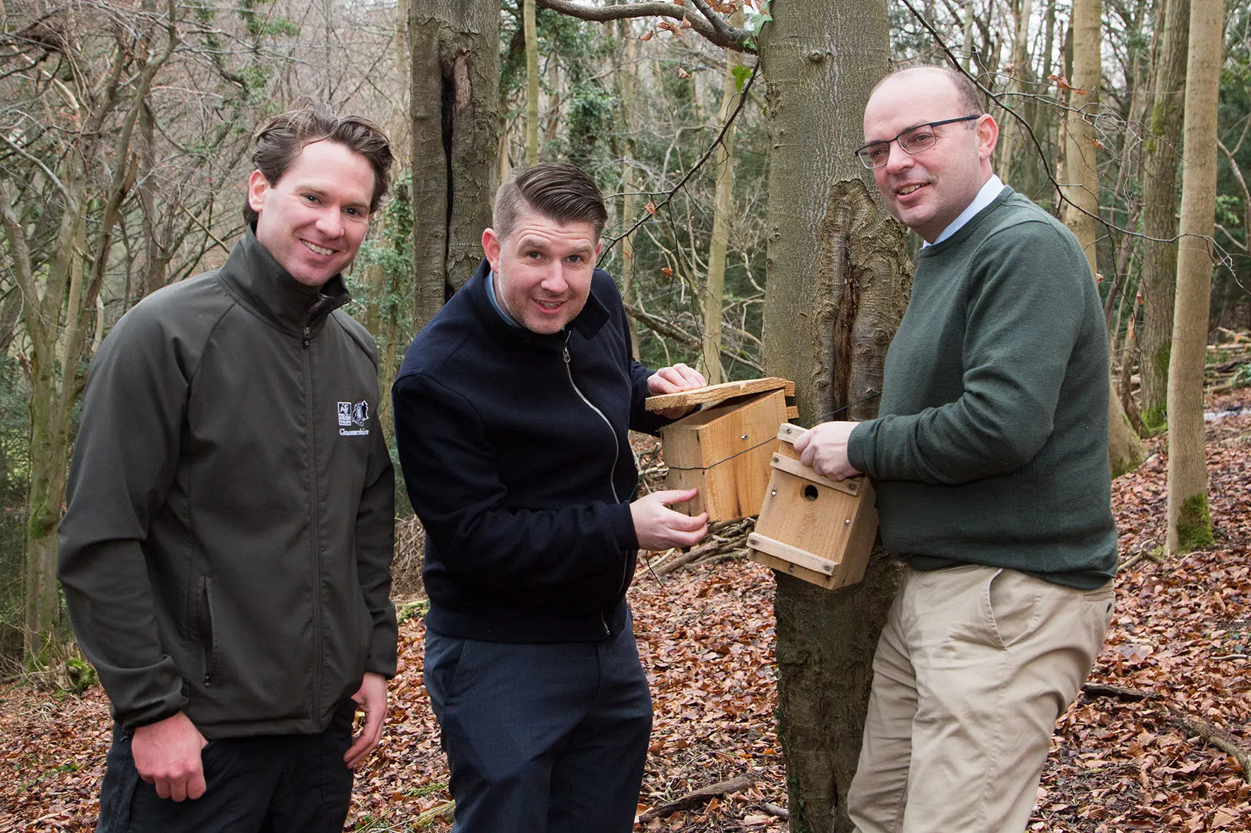 Creating an ideal environment for hazel dormice: Alan Sumnall, Stroud Reserve Manager for the Gloucestershire Wildlife Trust (right); Anthony Foxlee-Brown, Head of Marketing & Communications at Grundon (centre) and Andrew Short, Estates Director at Grundon, install nest boxes at the Laurie Lee Nature Reserve