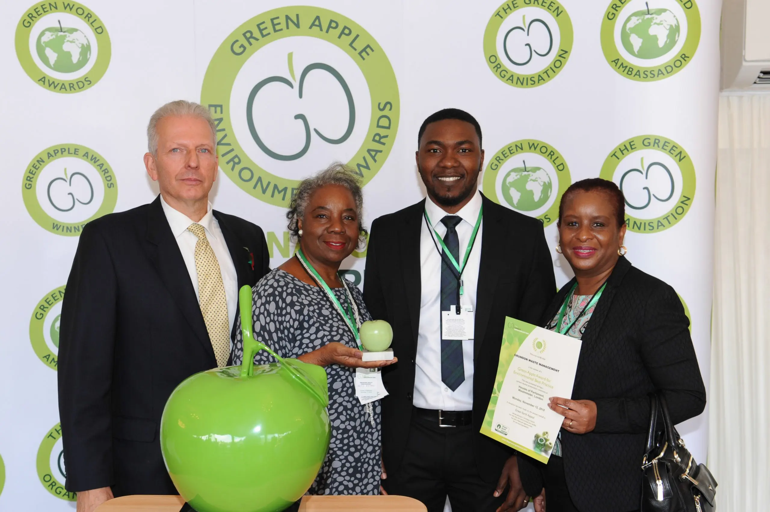 Successful partnership: Grundon's Toye Ogunleye, Waste Manager - NHS Trusts (centre); celebrates with Artis Richard and Brenda Brown from London North West Healthcare NHS Trust after scooping a bronze Green Apple Award in the Health Wastes Management category.