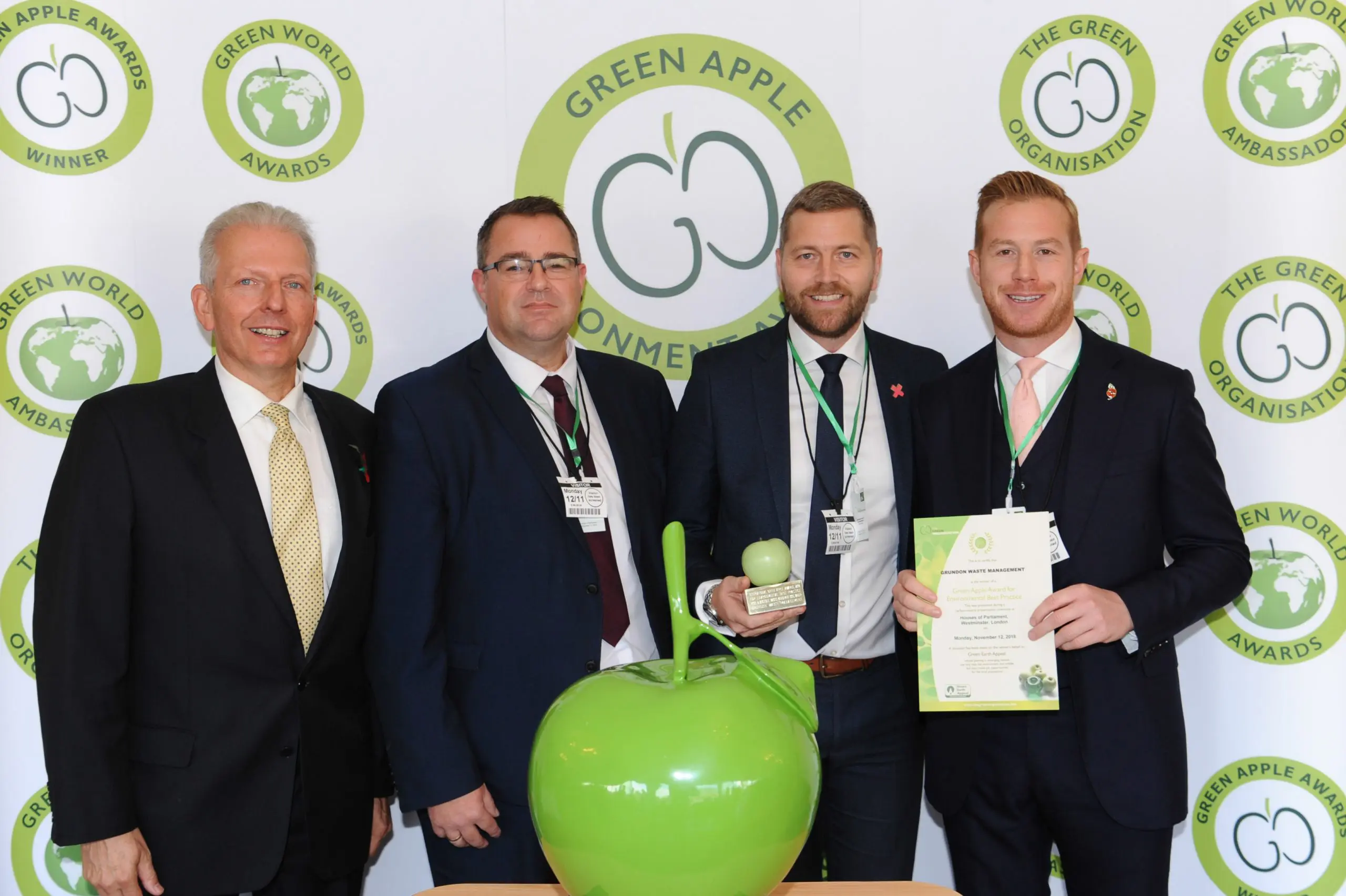 Gold standard: (from second left) Mark Peasley, Contract Manager at Grundon; Carl Meale, General Manager at Savills; and Stephen Hill, Head of Sales at Grundon, celebrate Xscape Milton Keynes taking top honours in the Retail and Wholesale Wastes Management category at the Green Apple Awards.