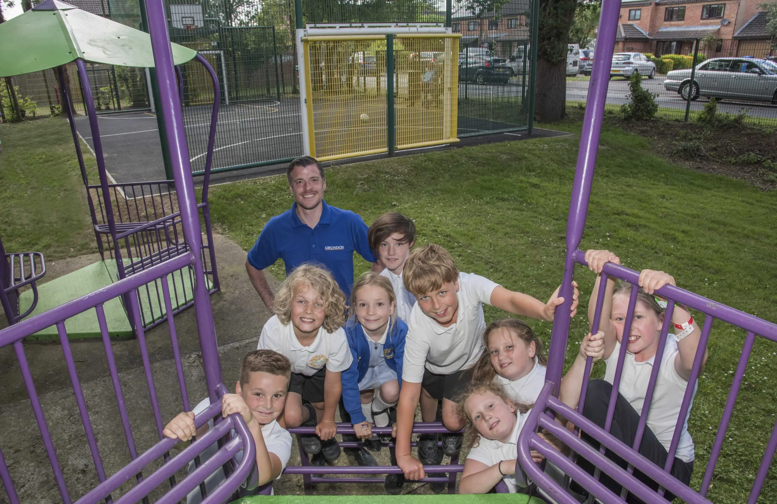 Grundon's Ben Cuthbertson is pictured as local schoolchildren try out the equipment