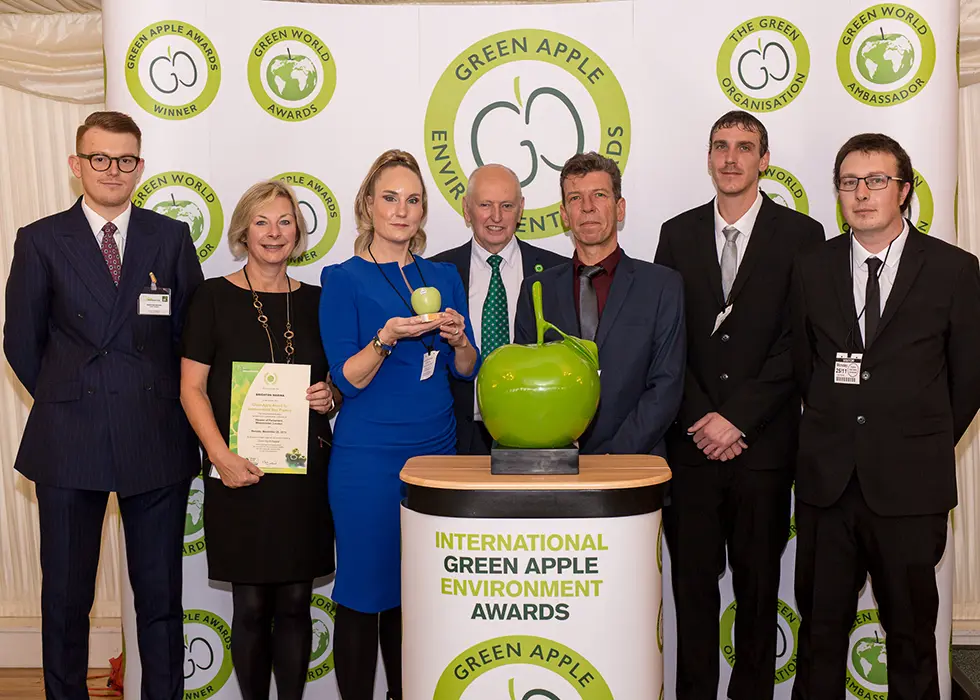 Grundon Waste Management's Andy Piasko, Contract Manager (left) joined the Brighton Marina team, including Kirsty Pollard, Centre Manager (third from left) to collect the Silver Green Apple Award for Environmental Best Practice in the Mixed Use Waste Management category from Roger Wolens, Founder of The Green Apple Awards and Chief Executive Officer of The Green Organisation (centre)