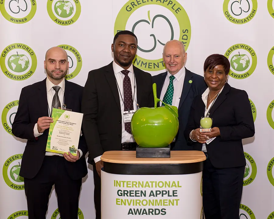 Grundon Waste Management's Joaquim Borges De Abreu and Toye Ogunleye (both left) joined Brenda Brown, Facilities Contracts Manager (right) to collect a second consecutive Bronze Green Apple Award for Environmental Best Practice in the Wastes Management NHS and Healthcare category for the London North West Healthcare (LNWH) NHS Trust from Roger Wolens, Founder of The Green Apple Awards and Chief Executive Officer of The Green Organisation (centre)