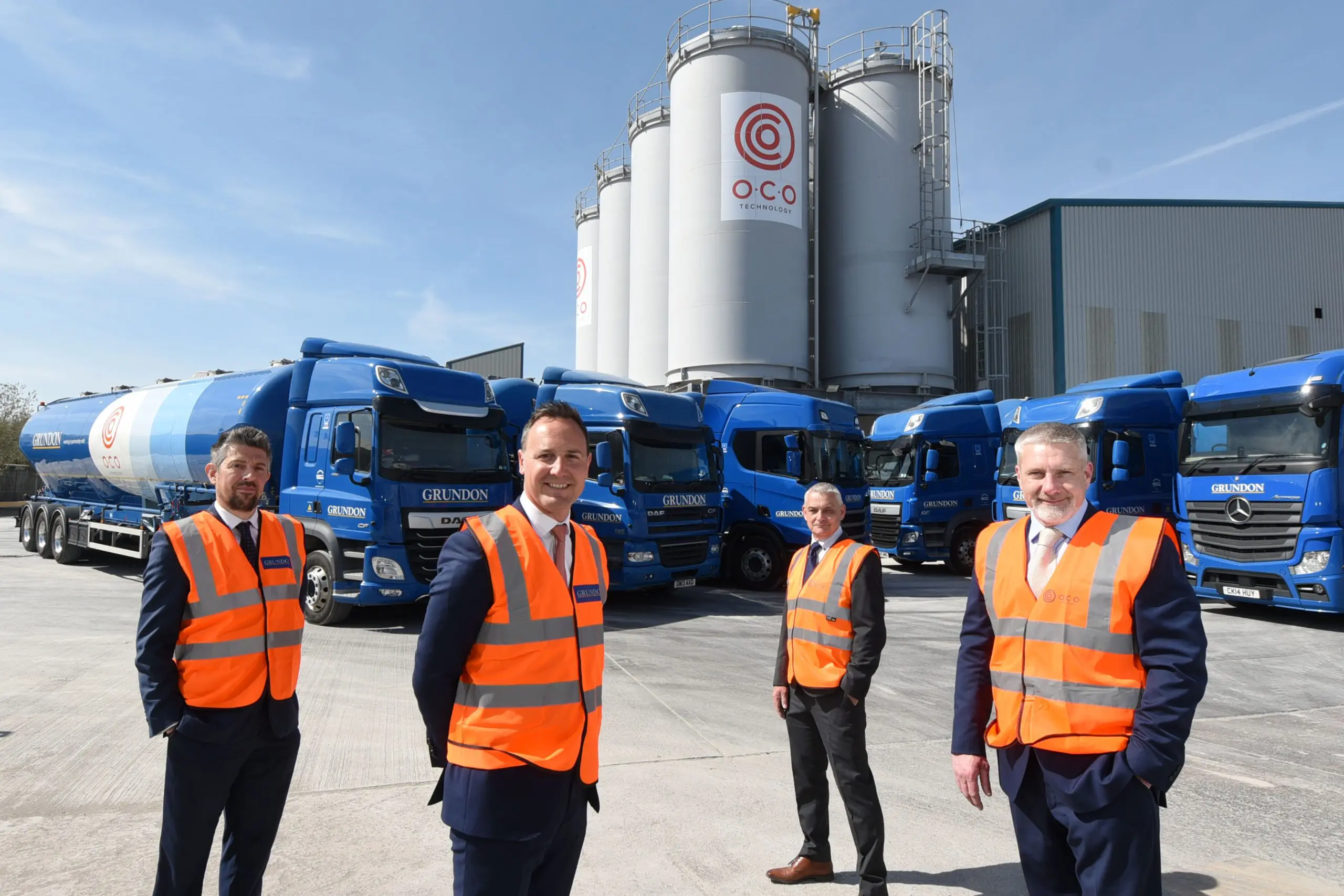 Pictured at O.C.O’s Avonmouth facility with the tanker fleet in the background, are (from left)  Richard Van-Den-Heule, Grundon’s Depot Operations Manager at Bishop's Cleeve; Bradley Smith, Grundon’s Sales & Marketing Director; Paul Barber, General Manager – Operations at O.C.O, and Steve Greig, O.C.O’s Managing Director.