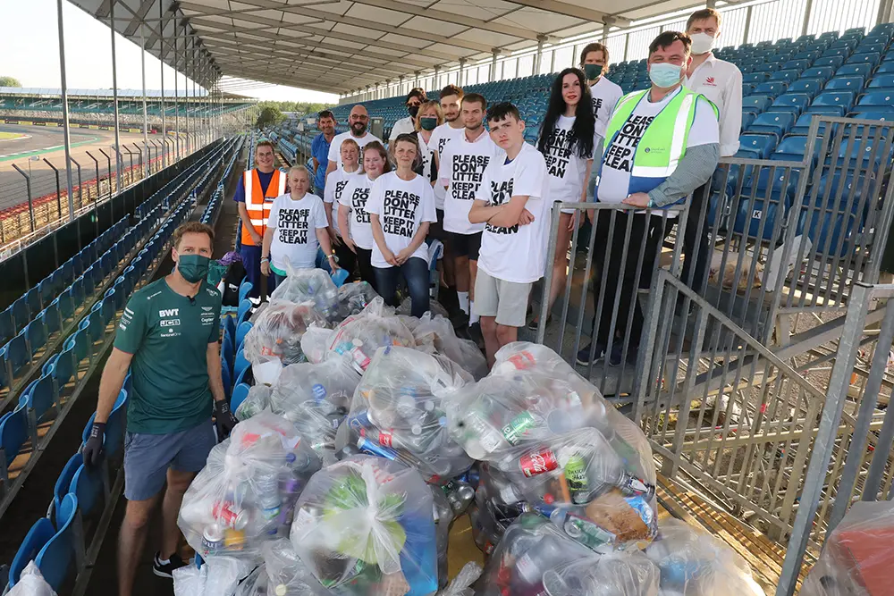 Cleaning up: Sebastian Vettel is pictured with a team of litter pickers at Silverstone after Sunday’s race, including Grace Grundon (second from left). © Jakob Ebrey/Silverstone