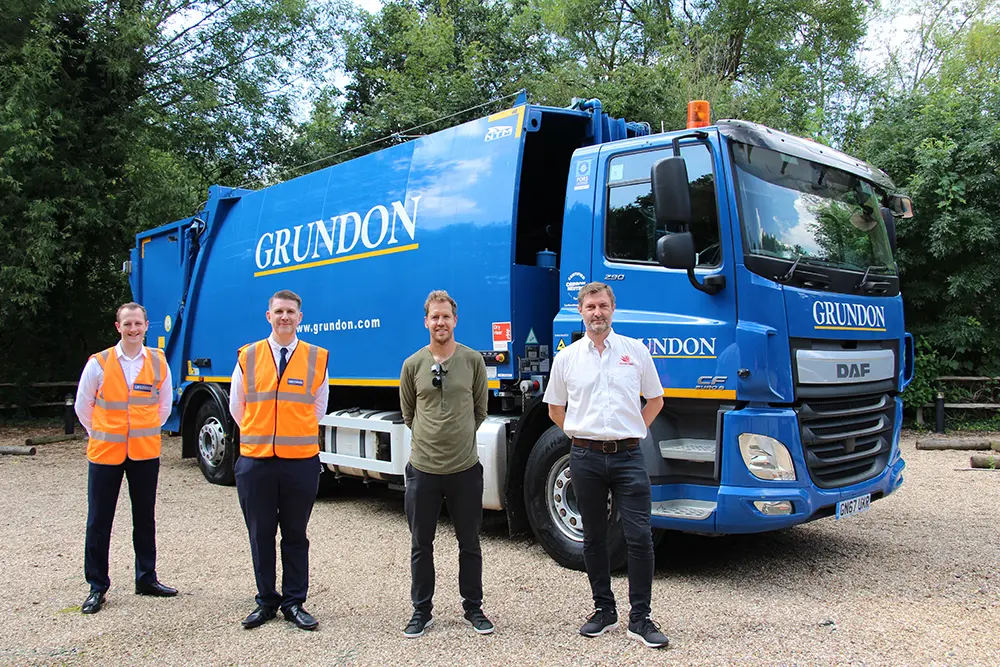 From litter picking to recycling: (From left to right) Grundon’s Owen George, Group Development and Innovation Manager; and Anthony Foxlee-Brown, Head of Marketing and Communications, welcomed four-time Formula 1 World Champion Sebastian Vettel and Stephane Bazire, Head of Business Sustainability at Silverstone Circuits Limited to a tour of Grundon’s waste treatment facilities in Colnbrook. Sebastian also got a first-hand look at Grundon’s ultra-low emission hydrogen/diesel dual-fuel waste collection vehicle 