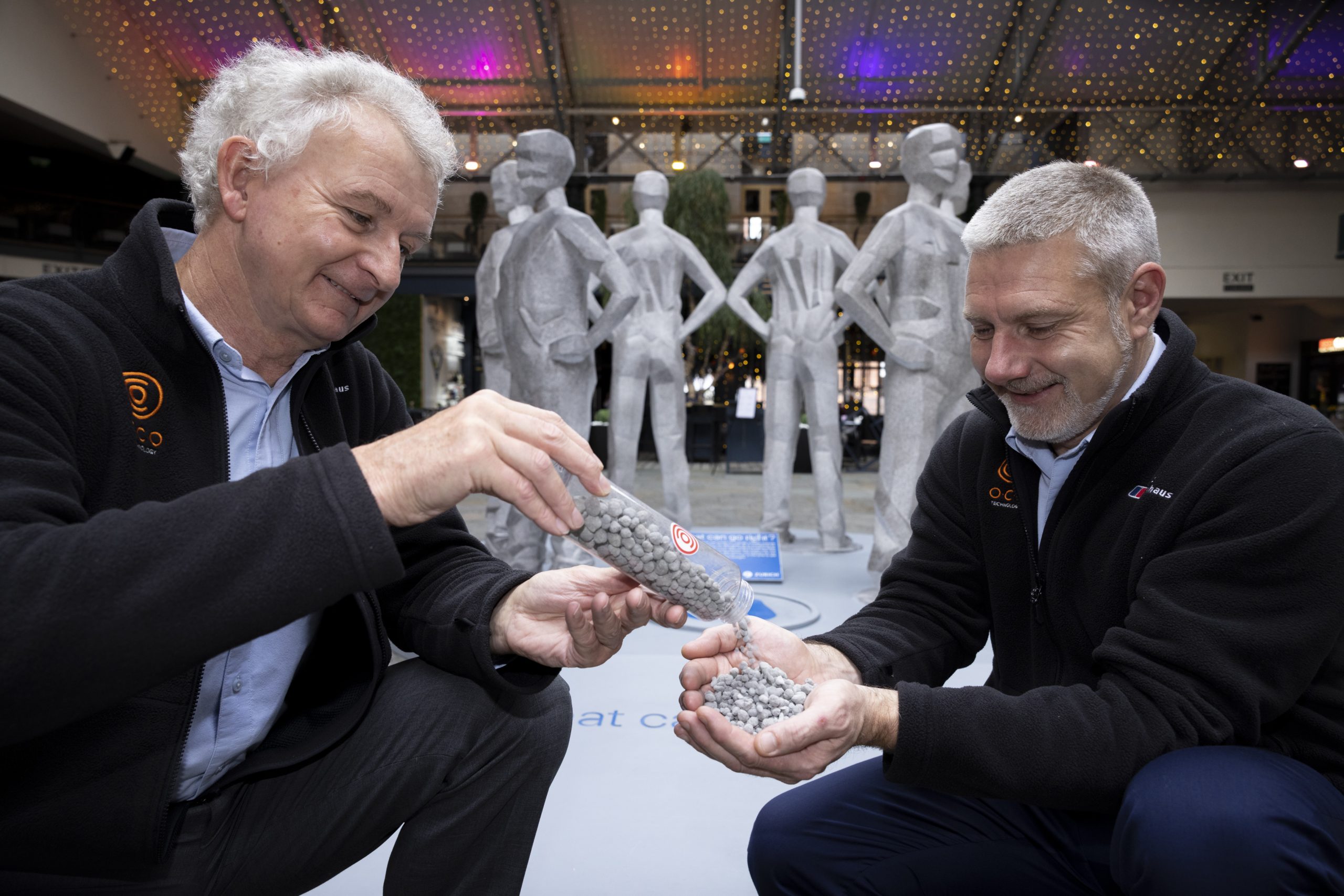 O.C.O Technology’s Technical Director, Stephen Roscoe and Managing Director, Steve Greig, are pictured in front of the statues with a sample of O.C.O’s carbon negative aggregate.