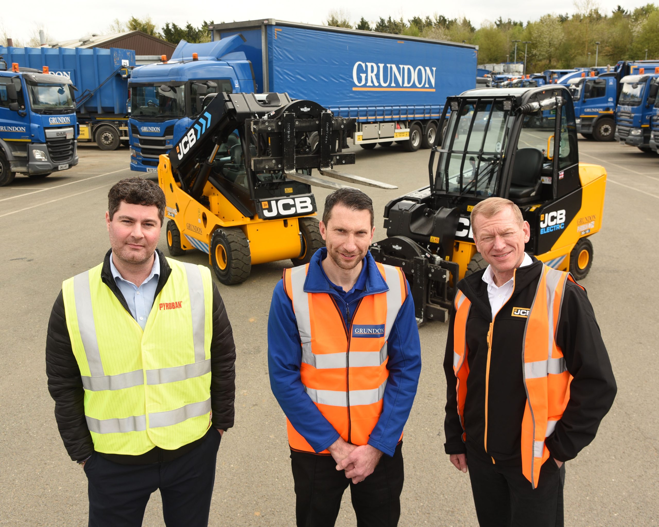 Pictured in front of the new electric Teletruk forklifts are (l-r) Matt Booth from Pyroban, Grundon’s Tim Buxton, and Brian Kumm, from Watling JCB