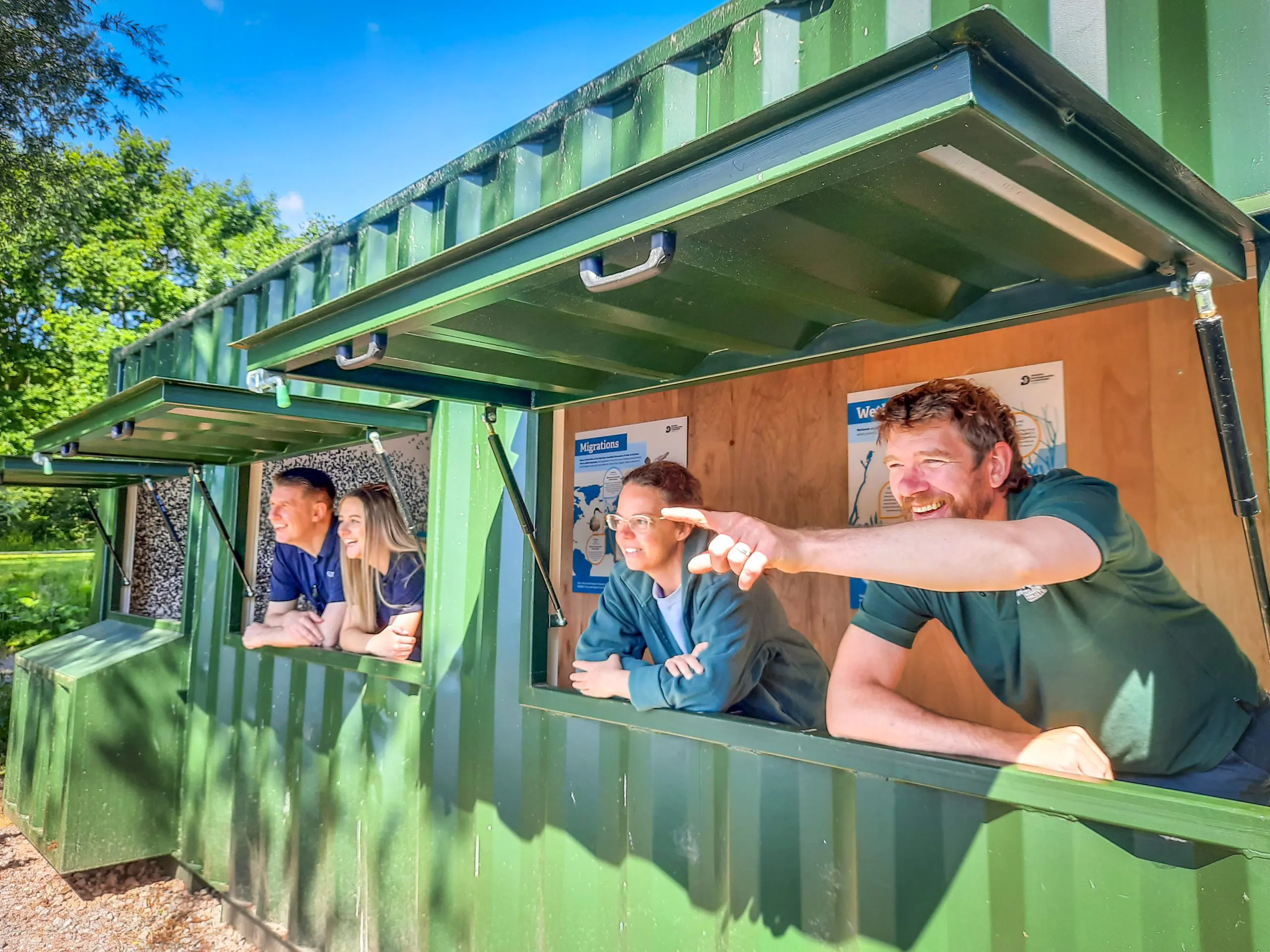 From left to right: Anthony Foxlee-Brown and Kirsti Santer of Grundon, and Tanya Alexander and Tom Hayward of BBOWT in the new lakeside bird hide. 