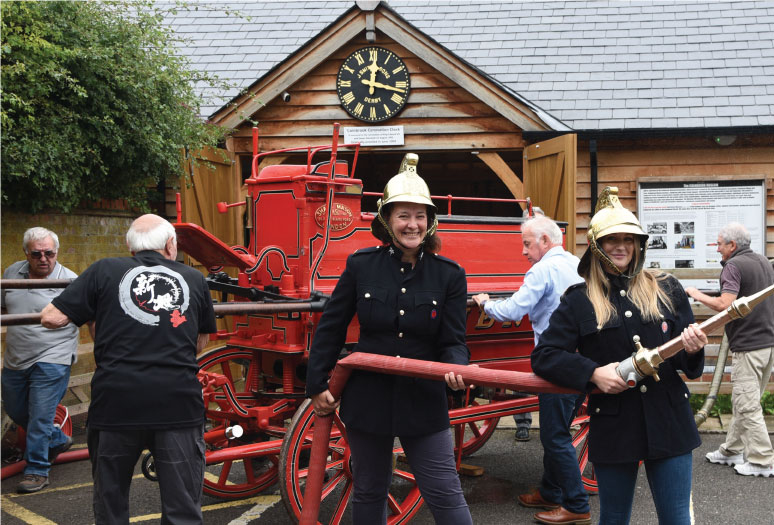 Michelle Jones and Kirsti Santer are put to work on the old fire engine at Colnbrook Museum