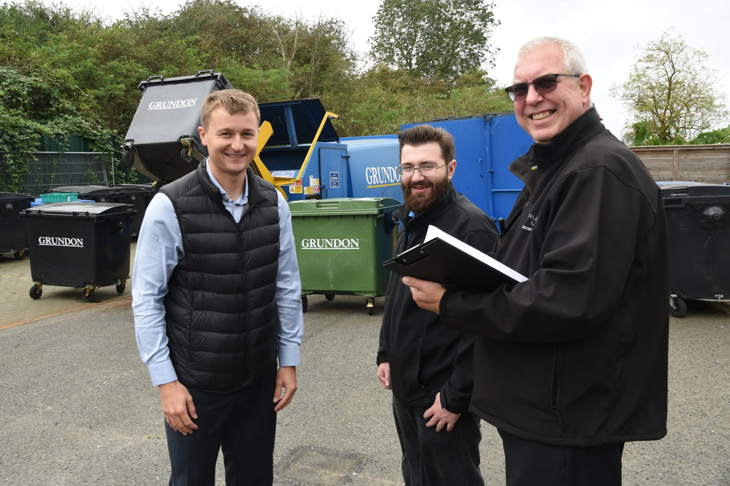 James Luckett, Jamie Denney and Alan Rademaker pictured in the service yard with Grundon’s containers and compactor