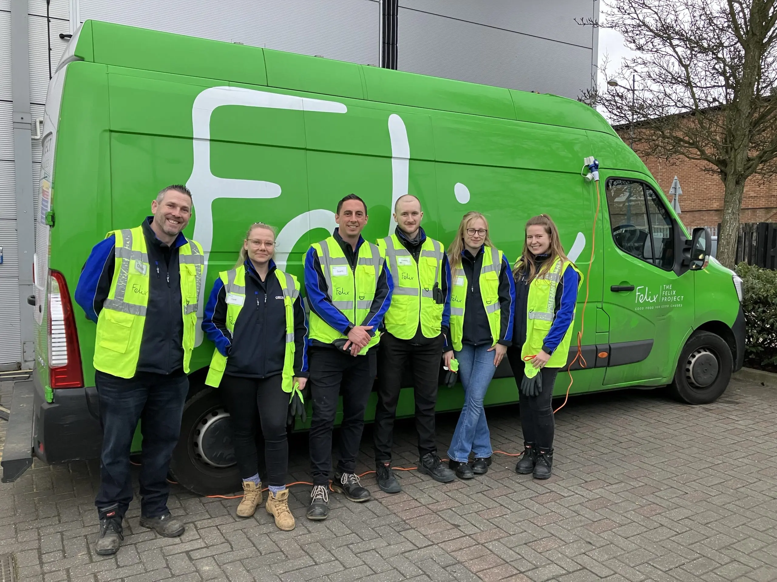 Ready for a day’s volunteering at The Felix Project’s Enfield depot: (l-r) Chris Tomkins, Senior Contract Manager, Faye Higgs, Contract Manager, Scott Williams, Head of Contract Management, James Douglas, Contract Engagement Assistant, Bethan Thomas, Junior Graphic Designer, Annie Sessions, Marketing Manager 