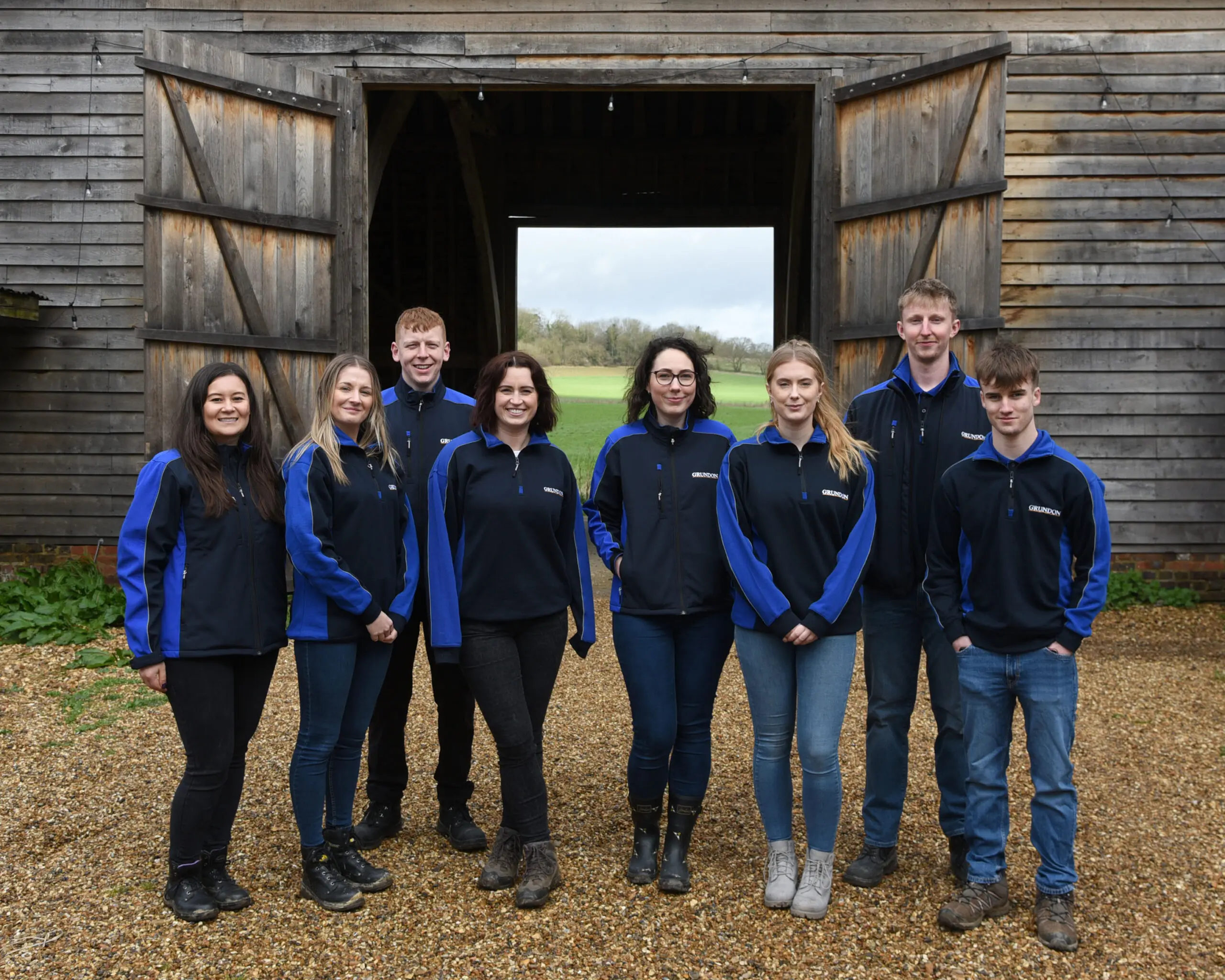 Ready for action - the Grundon volunteers in front of the new barn doors