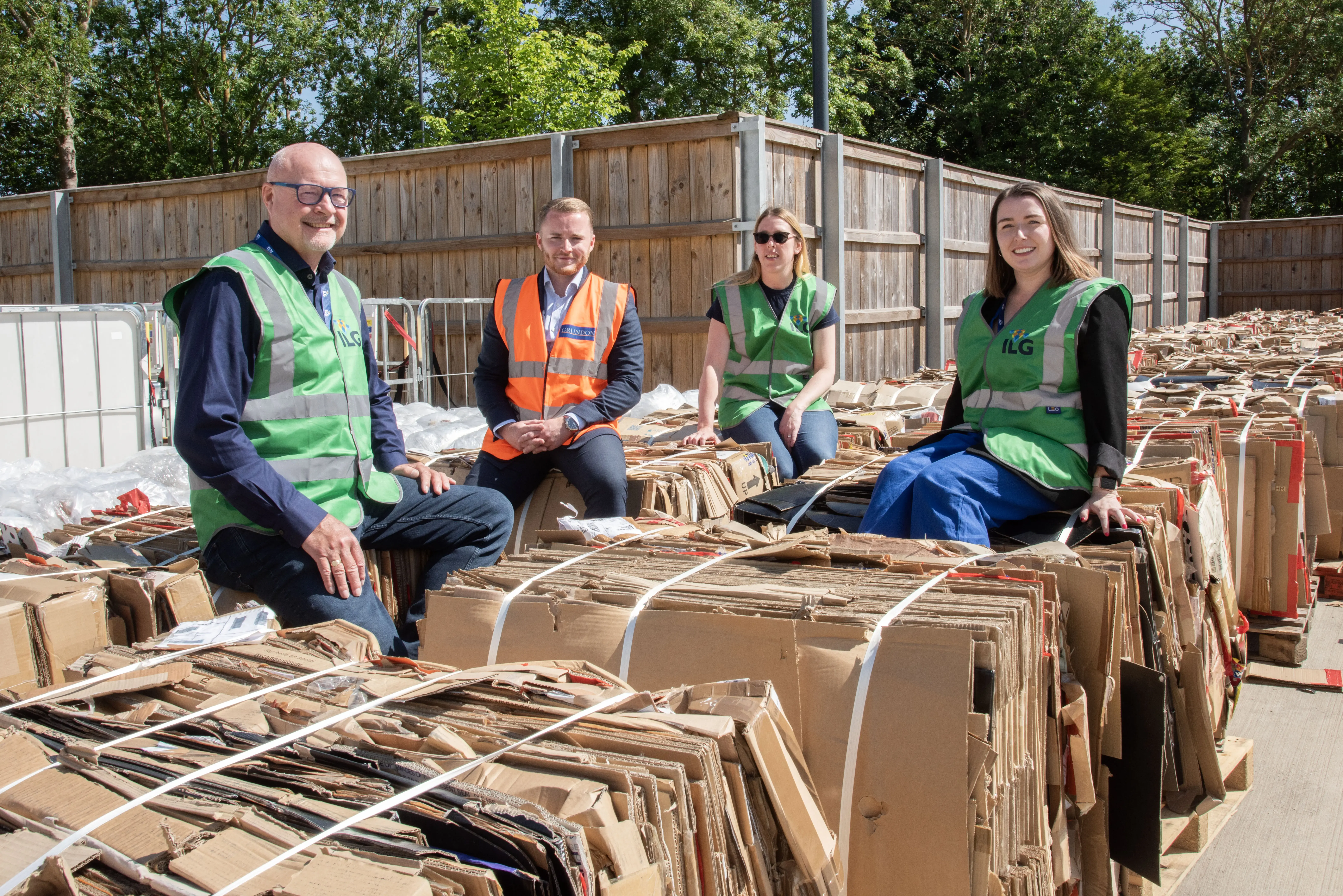 Baled over: Tonnes of cardboard is lined up in the service yard, ready for collection. Pictured l-r: Andy Hunt, Liam Nelmes, Helen Field and Chloe Gibbons.