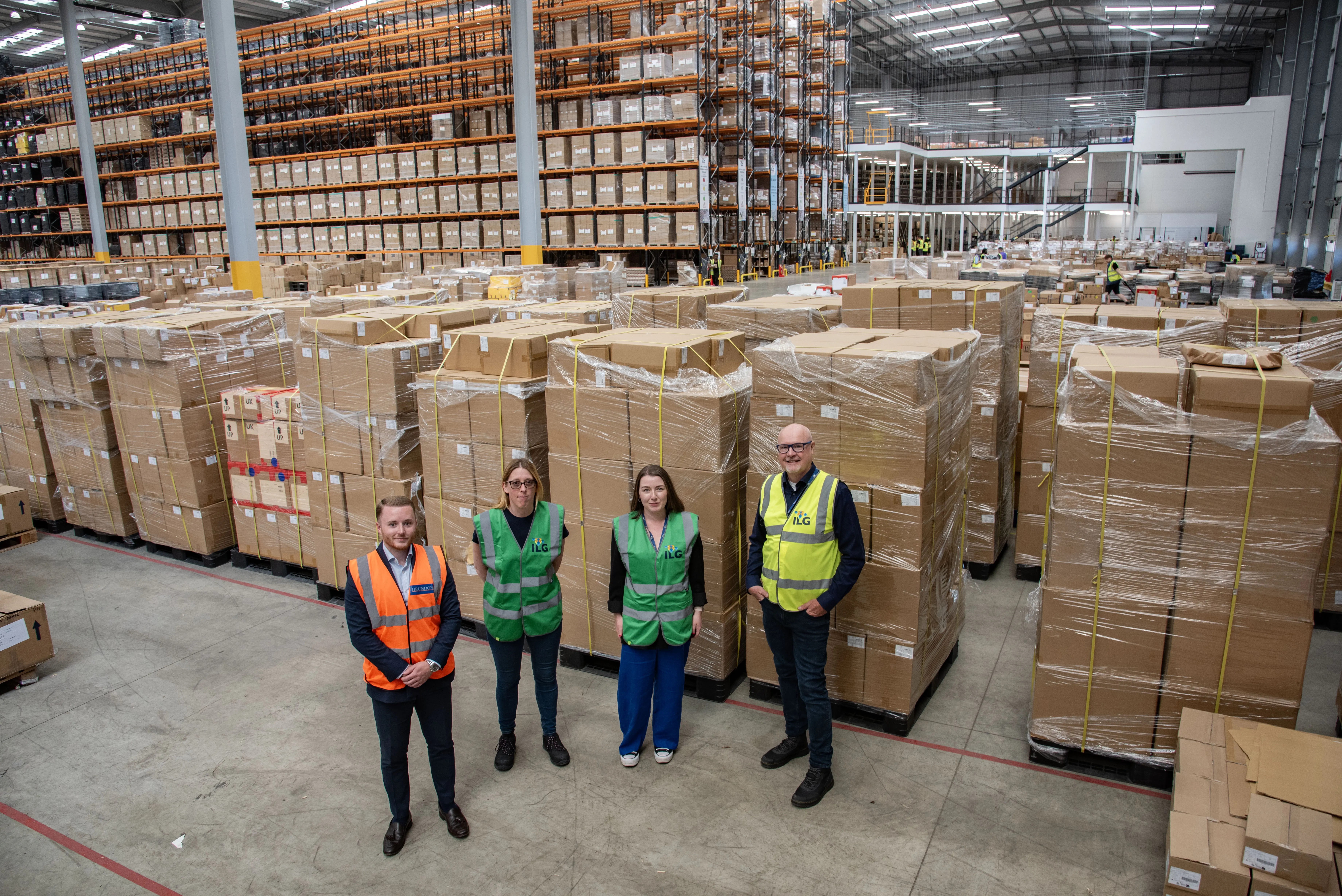 Boxed in – the size of the warehouse demonstrates just how much cardboard is dealt with at the facility. Pictured l-r: Grundon’s Liam Nelmes alongside ILG’s Helen Field, Site Manager at BM2 Northampton, Chloe Gibbons, Facilities, Environmental and Sustainability Advisor, and Andy Hunt, Marketing Director.