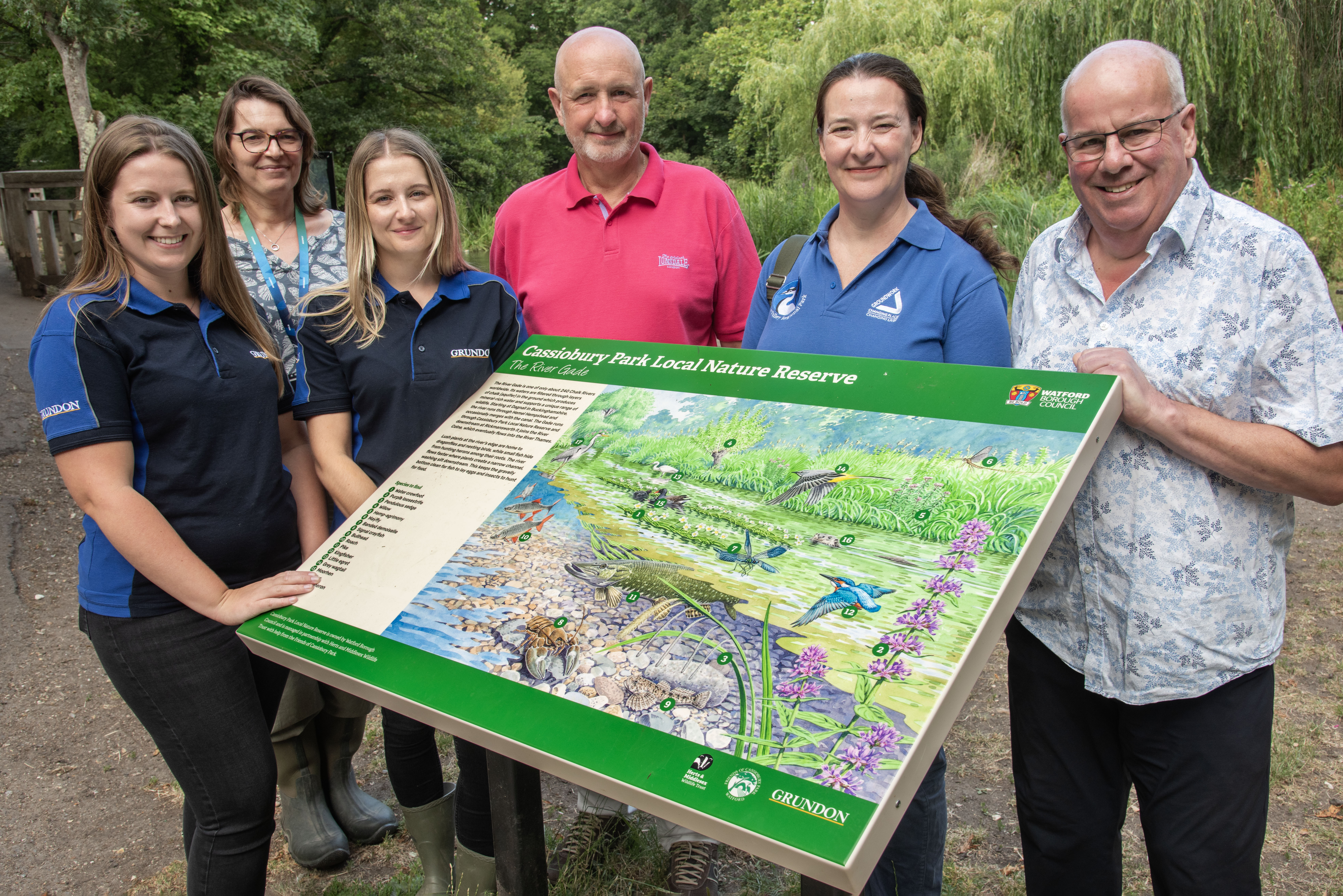Pictured with one of the interpretation boards during their recent visit (l-r): Annie Sessions, Grundon’s Marketing Manager; Isabel Crozier, Cassiobury Park & Oxhey Activity Park Manager, Kirsti Santer, Head of Marketing & Communications at Grundon; Cllr Tim Williams; Michelle Jones, Project Manager at Groundwork South; and Steve Jakeman, Chair of the Friends of Cassiobury Park.