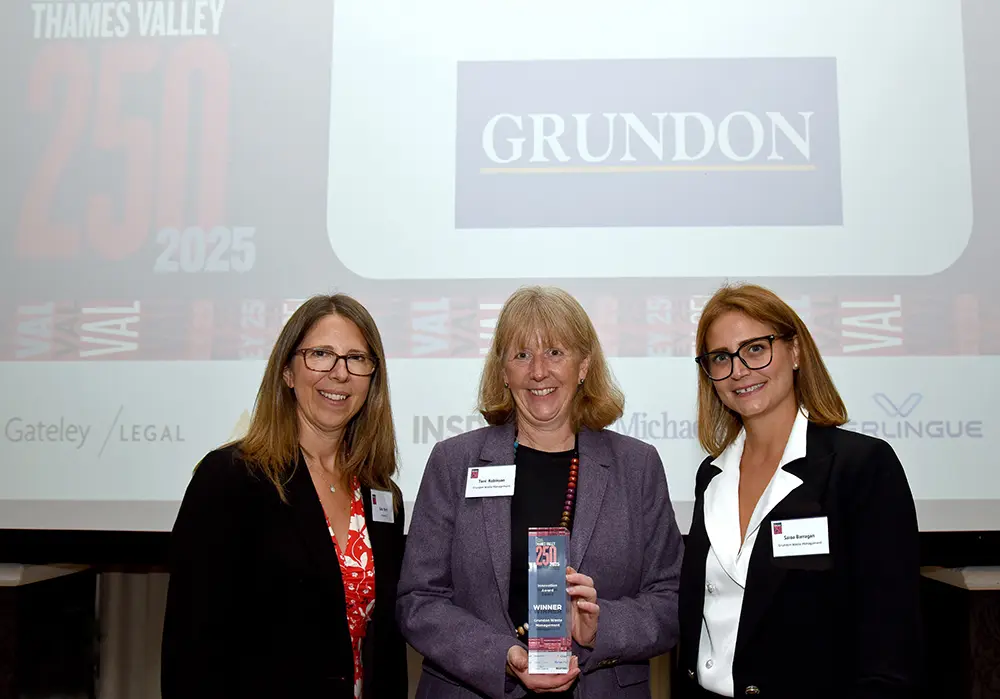 A delighted Toni Robinson, centre, celebrates Grundon’s Innovation Award with Kate Stent, left, and Grundon colleague Saioa Barragan, right.